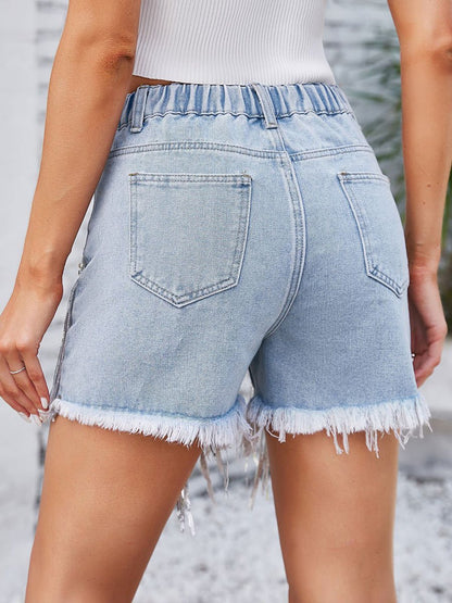 Short en jean délavé à pompons et perles pour femme 